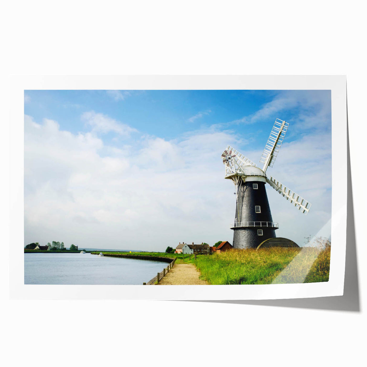 Vibrant rolled wall art print showcasing a serene landscape with windmills against a colorful sunset, ideal for home decor enthusiasts seeking unique artwork.