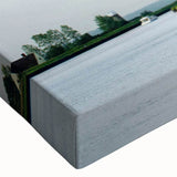 Close-up of a stretched canvas wall art piece showcasing a scenic landscape with windmills, vibrant colors enhancing the serene rural atmosphere, ideal for home decor.