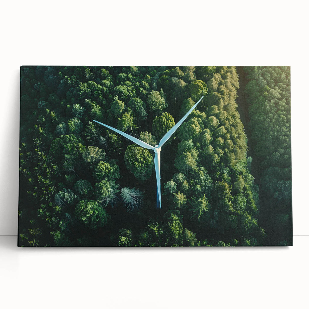 Stretched canvas wall art showcasing a scenic landscape with windmills against a vibrant sunset, leaning against a neutral wall, perfect for home decor.