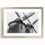 Framed wall art featuring a picturesque landscape with windmills, showcasing a silver mat and frame in a contemporary design, perfect for home decor.