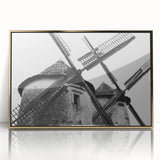 Framed wall art featuring a vibrant landscape with windmills, designed in gold accents, showcasing a scenic view perfect for home decor. Ideal for modern interiors.