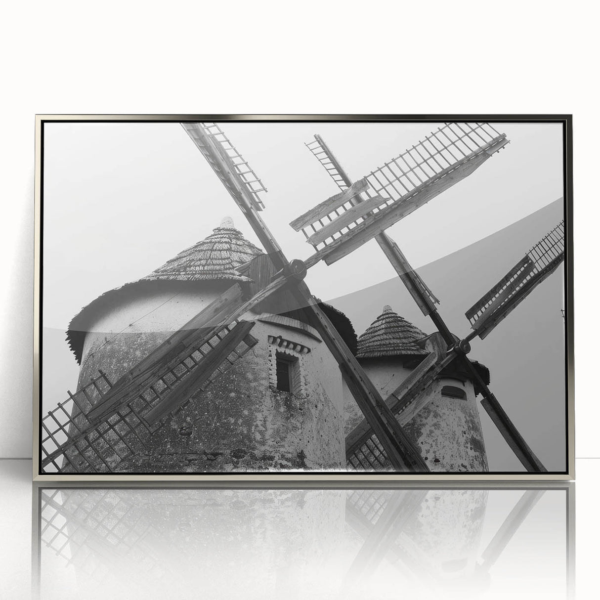 Framed wall art featuring a serene landscape with windmills against a vibrant sunset sky. The acrylic design showcases rich colors and intricate details, perfect for home decor.