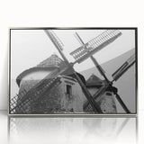 Framed wall art featuring a serene landscape with windmills against a vibrant sunset sky. The acrylic design showcases rich colors and intricate details, perfect for home decor.