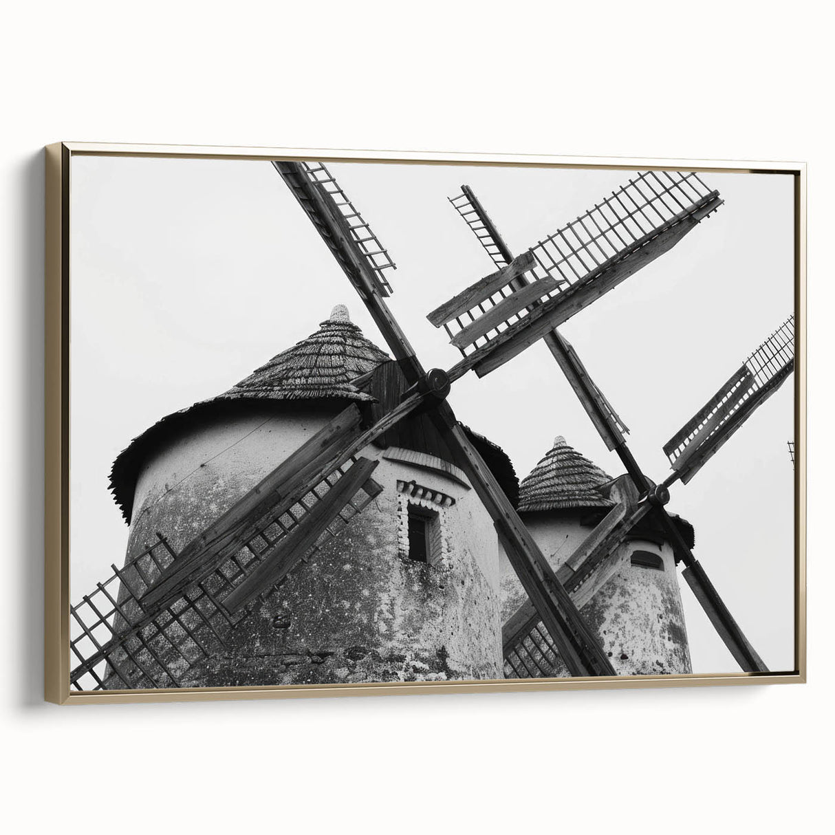 Framed canvas wall art showcasing a serene landscape with windmills, highlighted by gold accents and a side view perspective, ideal for home decor.