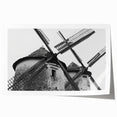 Vibrant rolled print of a serene landscape featuring windmills against a sunset backdrop, ideal for home decor or office art collection, showcasing natural beauty and tranquility.