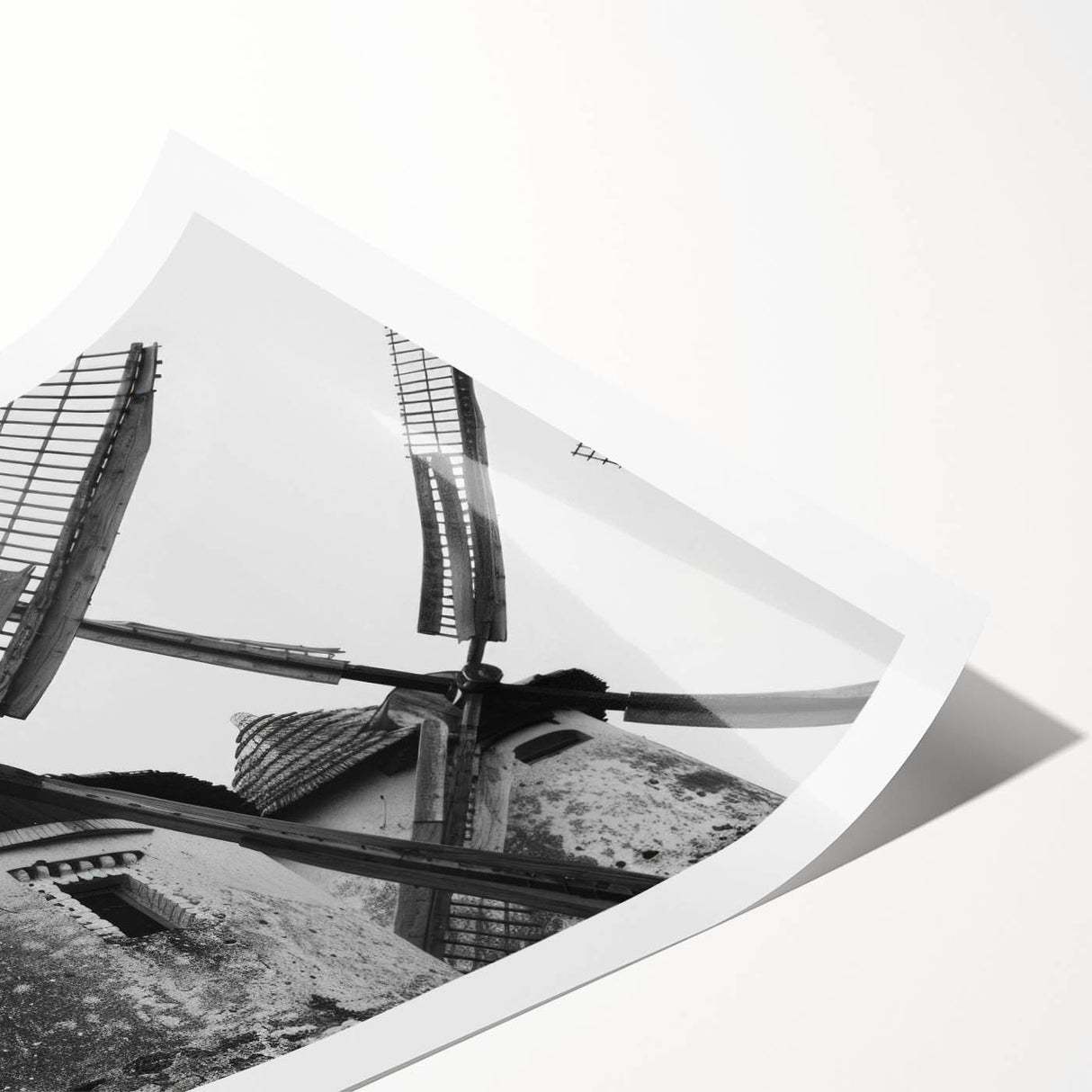 Rolled print showcasing a vibrant landscape scene with windmills under a clear blue sky, perfect for home decor and interior design enhancement.