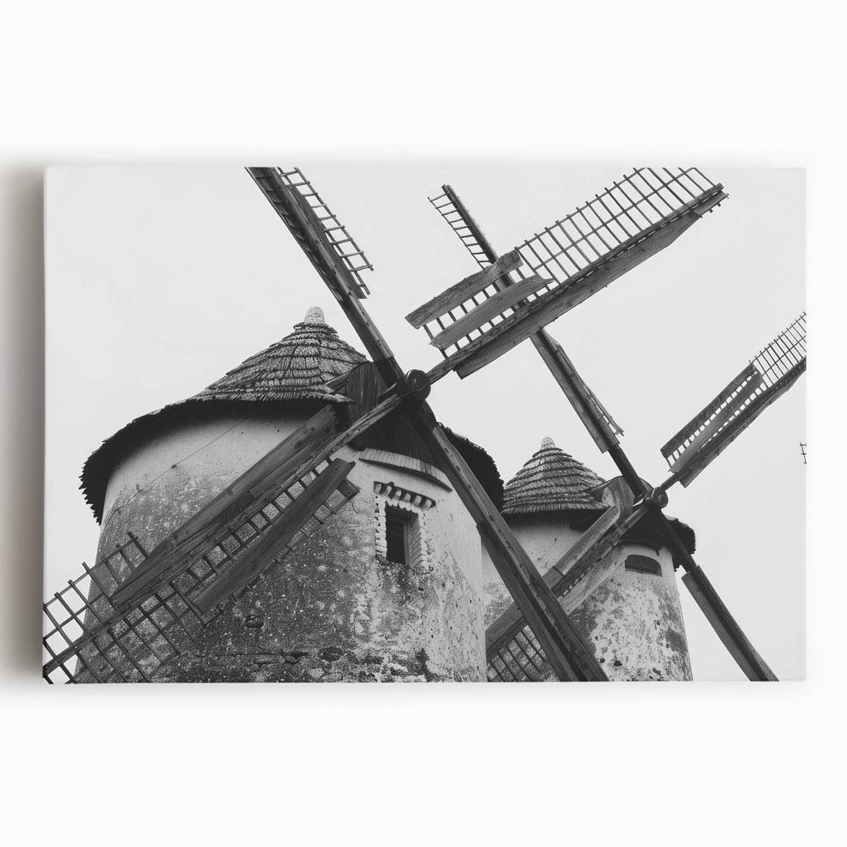 Stretched canvas wall art showcasing a picturesque landscape with windmills, featuring vibrant colors and intricate details, perfect for home decor enhancement.