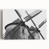 Stretched canvas wall art showcasing a picturesque landscape with windmills, featuring vibrant colors and intricate details, perfect for home decor enhancement.