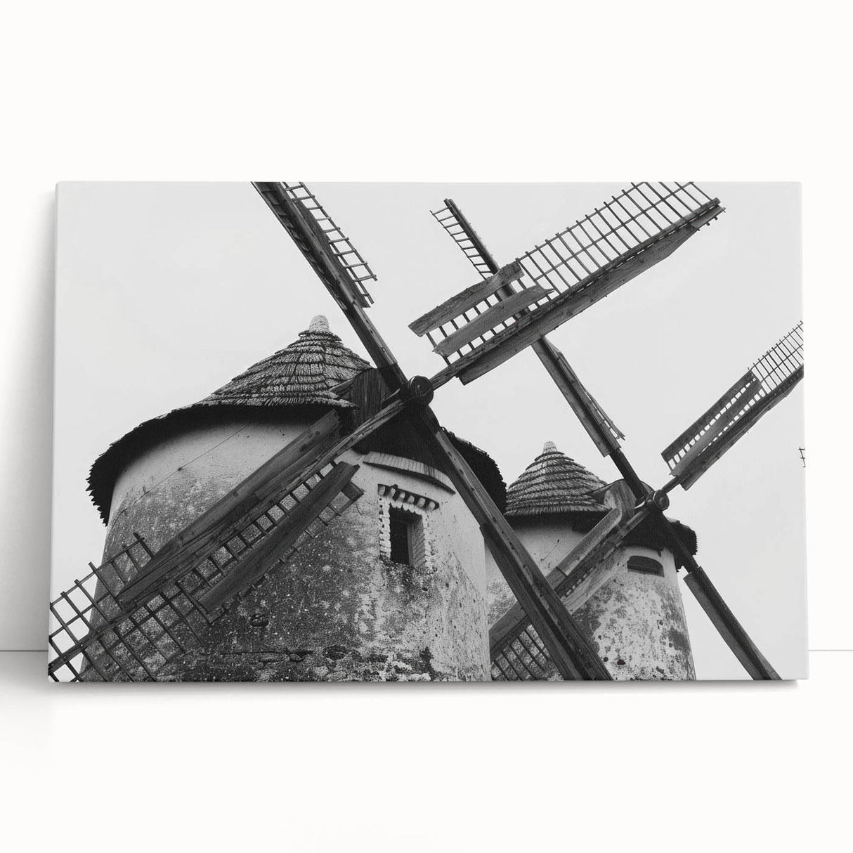 Stretched canvas wall art depicting a serene landscape with windmills, showcasing soft pastel colors and a peaceful ambiance, perfect for home decor.