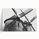 Stretched canvas wall art depicting a serene landscape with windmills, showcasing soft pastel colors and a peaceful ambiance, perfect for home decor.