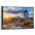 Framed canvas wall art showcasing a scenic landscape with windmills, featuring a sleek black frame and vibrant colors, ideal for enhancing modern home decor.