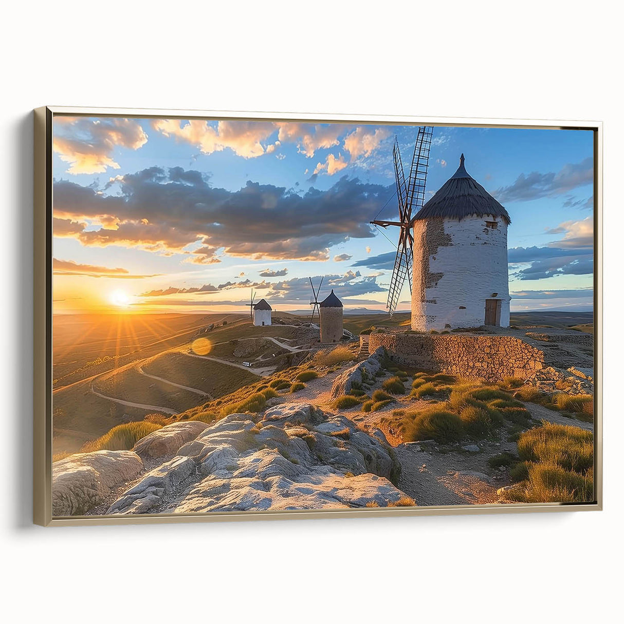 Framed wall art canvas featuring a scenic landscape with windmills, adorned with a gold frame, showcasing a serene countryside view, perfect for home decor.