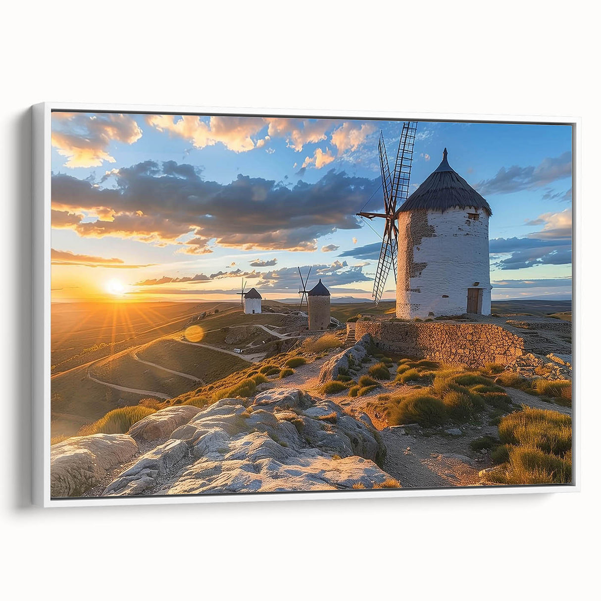 Framed canvas wall art showcasing a serene landscape with windmills, featuring a white frame and a side view perspective, perfect for home decor.