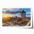 Rolled print showcasing a serene landscape with windmills against a colorful sunset, ideal for home decor, available in a protective cardboard tube.