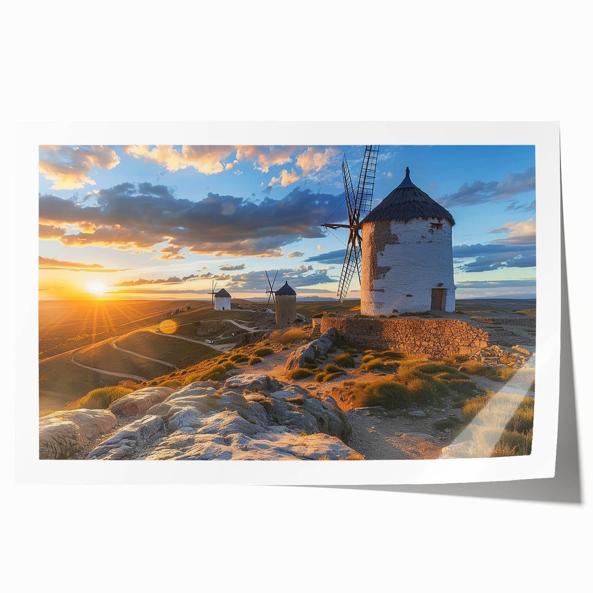 Rolled print showcasing a serene landscape with windmills against a colorful sunset, ideal for home decor, available in a protective cardboard tube.