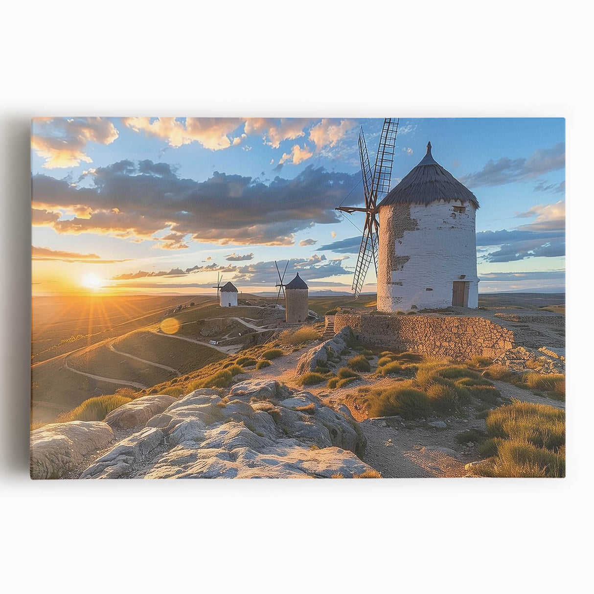 Stretched canvas wall art depicting a serene landscape with windmills against a vibrant sunset, showcasing rich colors and detailed textures, perfect for home decor.