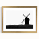 Golden-framed wall art featuring a serene landscape with windmills, showcasing intricate details and vibrant colors, perfect for home decor enhancement.