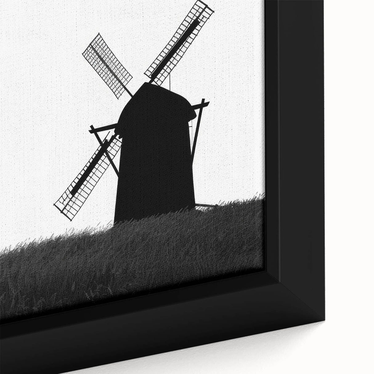 Close-up of a framed canvas wall art piece featuring a picturesque landscape with windmills, showcasing vibrant colors and intricate details, perfect for home decor.