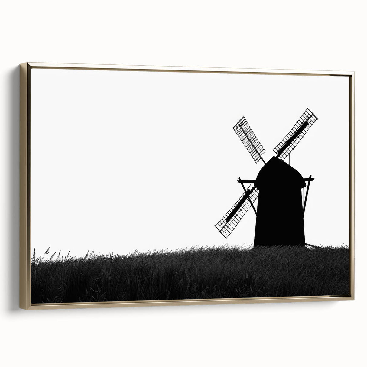 Framed canvas wall art featuring a picturesque landscape with windmills, highlighted in gold accents, displayed in a side view to emphasize its elegant design.