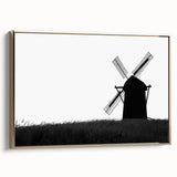 Framed canvas wall art featuring a picturesque landscape with windmills, highlighted in gold accents, displayed in a side view to emphasize its elegant design.
