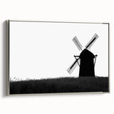 Framed wall art featuring a serene landscape with windmills, set against a vibrant sunset backdrop. The silver frame adds elegance, enhancing home decor appeal.