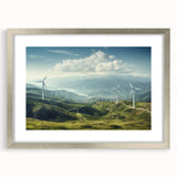 Framed landscape wall art featuring windmills in a serene countryside setting, presented in a silver mat, ideal for enhancing home decor with a touch of elegance.