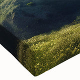 Close-up of a stretched canvas showcasing intricate landscape design with windmills, vibrant colors, and detailed textures, perfect for home decor or art collection.