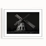 Framed wall art piece showcasing a serene landscape with windmills, featuring a white mat and sleek frame, perfect for enhancing home decor with a tranquil vibe.