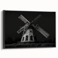 Framed canvas wall art showcasing a vibrant windmill landscape design, featuring a black frame and side view, perfect for home decor enthusiasts.