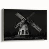 Framed canvas wall art showcasing a serene landscape with windmills, featuring a silver frame, perfect for home decor and enhancing interior aesthetics.