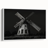Framed canvas wall art depicting a scenic landscape with windmills, presented in a white frame, showcasing vibrant colors and serene countryside beauty. Ideal for home decor enthusiasts.