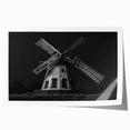 Rolled print of a serene landscape featuring windmills against a sunset backdrop, showcasing vibrant colors and intricate details, perfect for home decor.