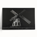 Stretched canvas wall art depicting serene landscapes with windmills, showcasing soft hues of blue and green, perfect for home decor. Ideal for adding a tranquil touch to any room.
