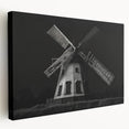 Stretched canvas wall art showcasing a serene landscape with windmills against a vibrant sunset, perfect for home decor enthusiasts seeking a tranquil ambiance.