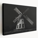 Stretched canvas wall art showcasing a serene landscape with windmills against a vibrant sunset, perfect for home decor enthusiasts seeking a tranquil ambiance.
