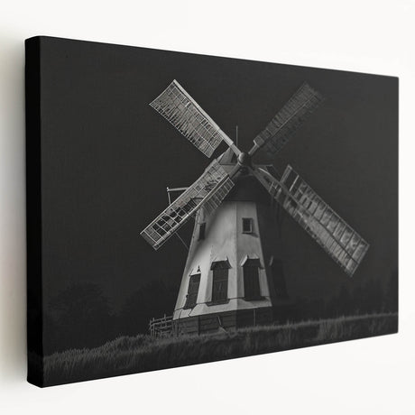 Stretched canvas wall art showcasing a serene landscape with windmills against a vibrant sunset, perfect for home decor enthusiasts seeking a tranquil ambiance.