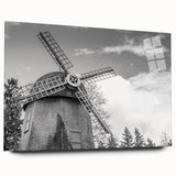 Acrylic glass wall art featuring a scenic landscape design with windmills, displayed from a side view, showcasing vibrant colors and intricate details, ideal for home decor.