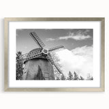 Framed wall art featuring a serene landscape with windmills, elegantly displayed with a silver mat, perfect for enhancing home decor and adding a tranquil ambiance.