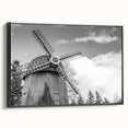 Framed canvas wall art showcasing a picturesque landscape with windmills, featuring a black frame and side view, perfect for home decor and interior styling.
