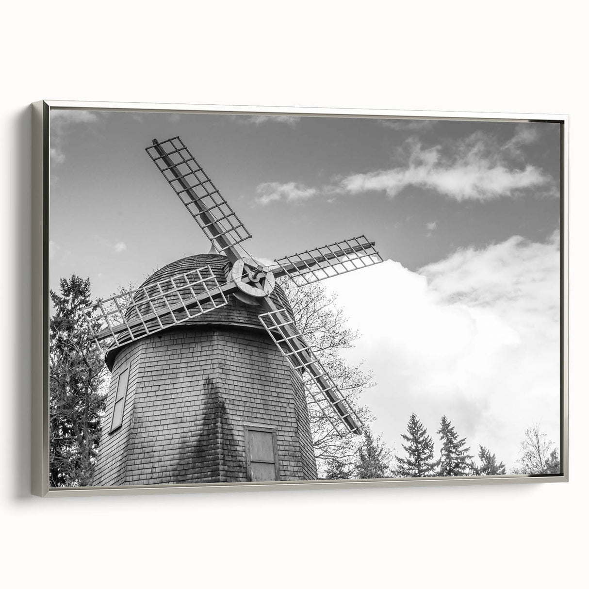 Framed wall art featuring a serene landscape of windmills against a sunset backdrop, showcasing vibrant colors and detailed textures, perfect for home décor.