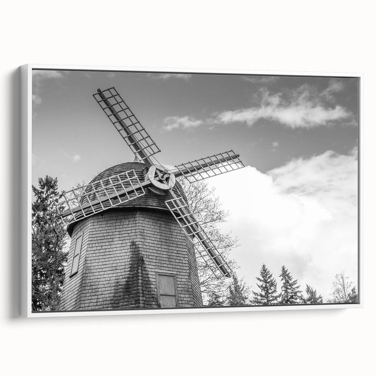 Framed canvas wall art showcasing a serene landscape with windmills under a bright blue sky, highlighting vibrant colors and detailed textures, perfect for home decor.