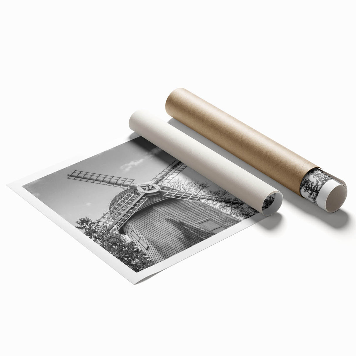 Rolled print showcasing a picturesque landscape with windmills set against a vibrant sunset, ideal for home decor or art collection, packaged in protective cardboard.