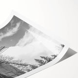 Vibrant rolled print of a landscape featuring windmills against a colorful sunset, designed for wall art decoration, showcasing intricate detailing and vivid colors.