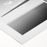 Rolled canvas artwork depicting a serene landscape with windmills, showcasing vibrant colors and intricate details, ideal for home or office decor.