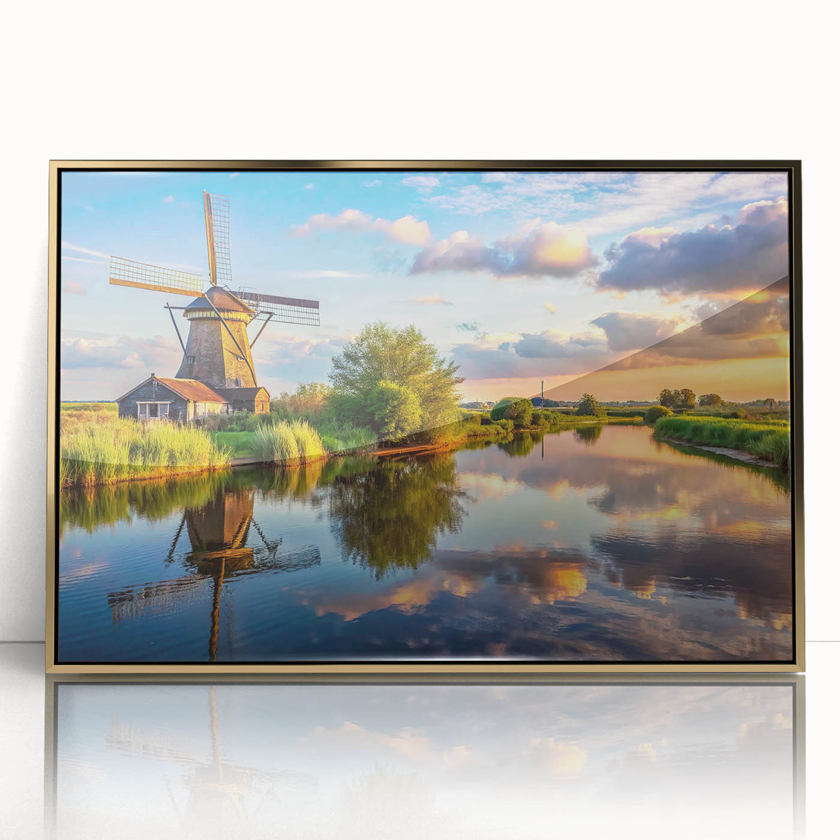 Framed wall art featuring a picturesque landscape of windmills under a vibrant sky, designed with gold accents for a modern touch, perfect for home decor.
