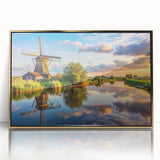 Framed wall art featuring a picturesque landscape of windmills under a vibrant sky, designed with gold accents for a modern touch, perfect for home decor.