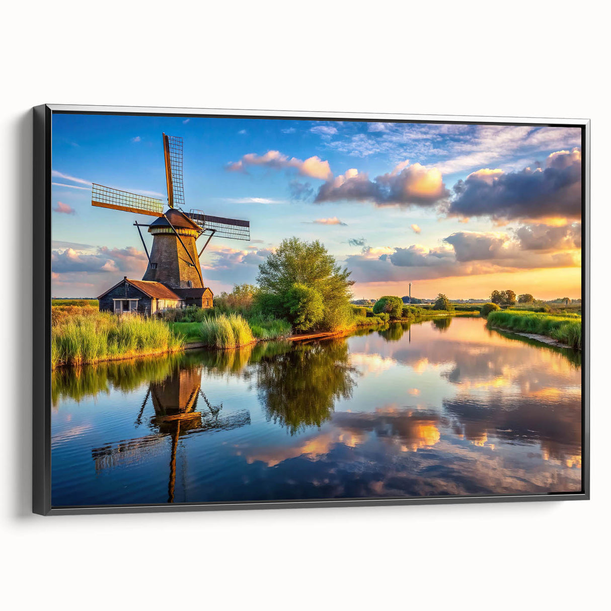 Framed canvas wall art showcasing a serene landscape with windmills against a vibrant sunset, featuring a sleek black frame and side view display. Perfect for home decor enthusiasts seeking nature-inspired artwork.