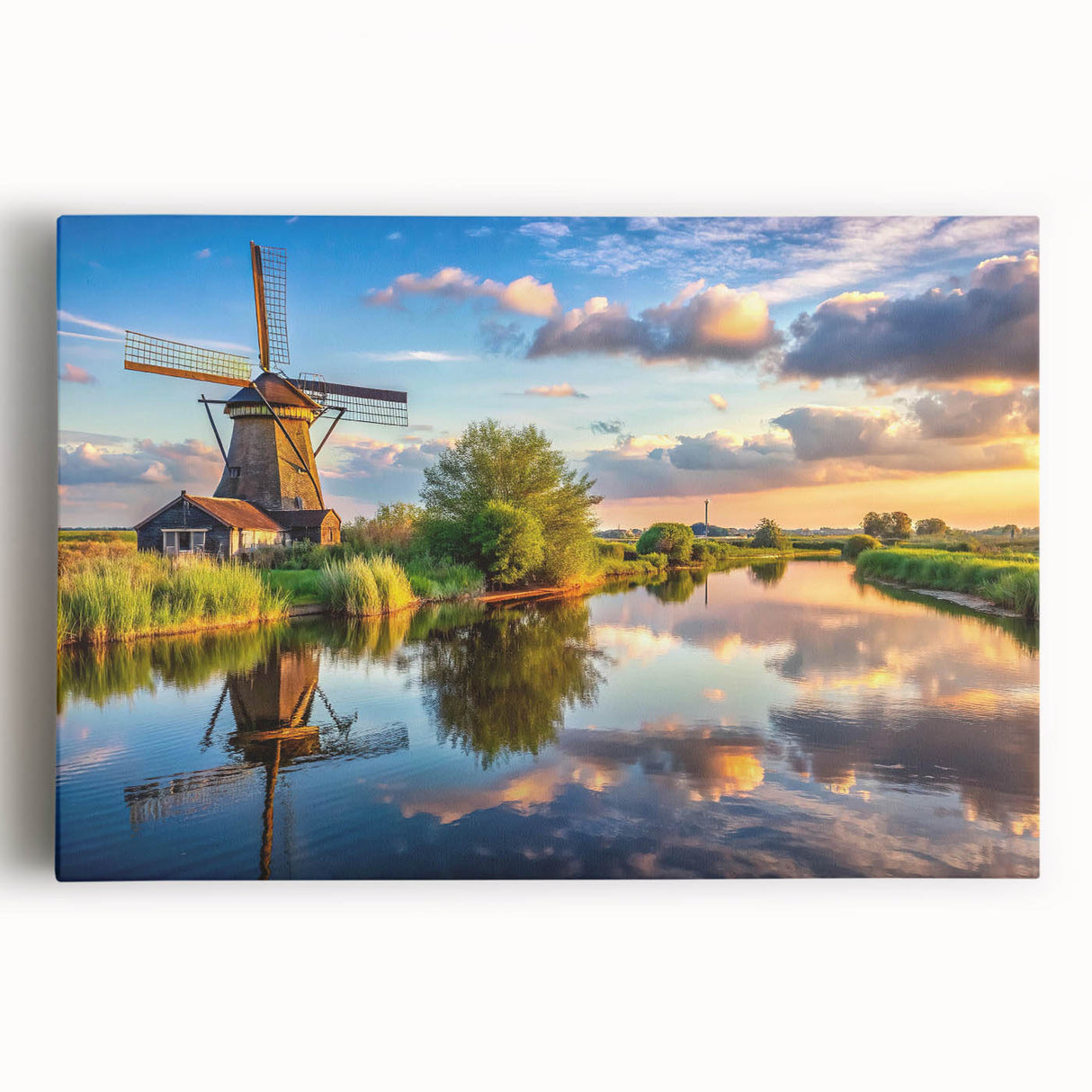 Stretched canvas wall art showcasing a serene landscape with windmills against a vibrant sunset, ideal for home decor and enhancing living spaces.