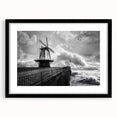 Black-framed wall art showcasing a stunning landscape of windmills against a vibrant sunset, ideal for modern home decor and art enthusiasts. Perfect for adding elegance to living spaces.