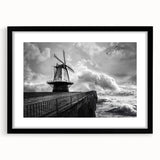 Black-framed wall art showcasing a stunning landscape of windmills against a vibrant sunset, ideal for modern home decor and art enthusiasts. Perfect for adding elegance to living spaces.